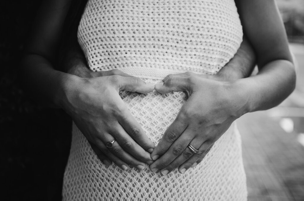 grayscale photo of person wearing ring