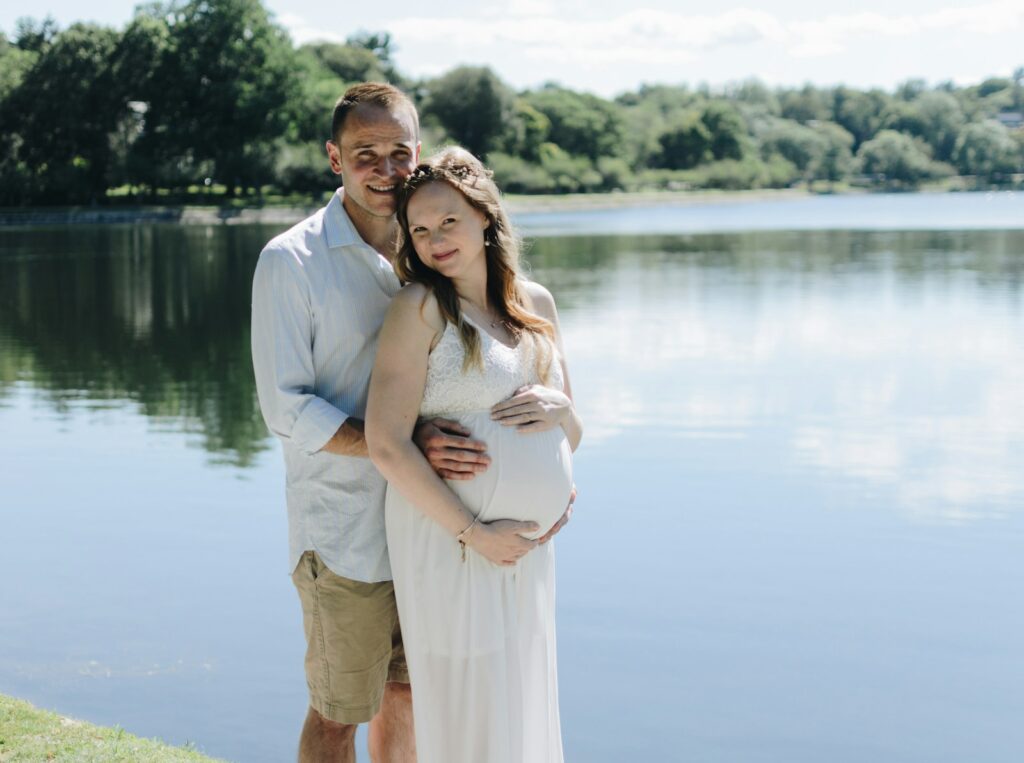 man holding woman tummy