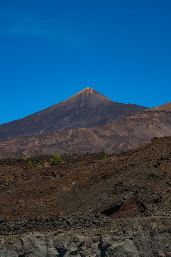 A stunning view of Mount Teide against a clear blue sky in Tenerife, ideal for nature and travel themes.