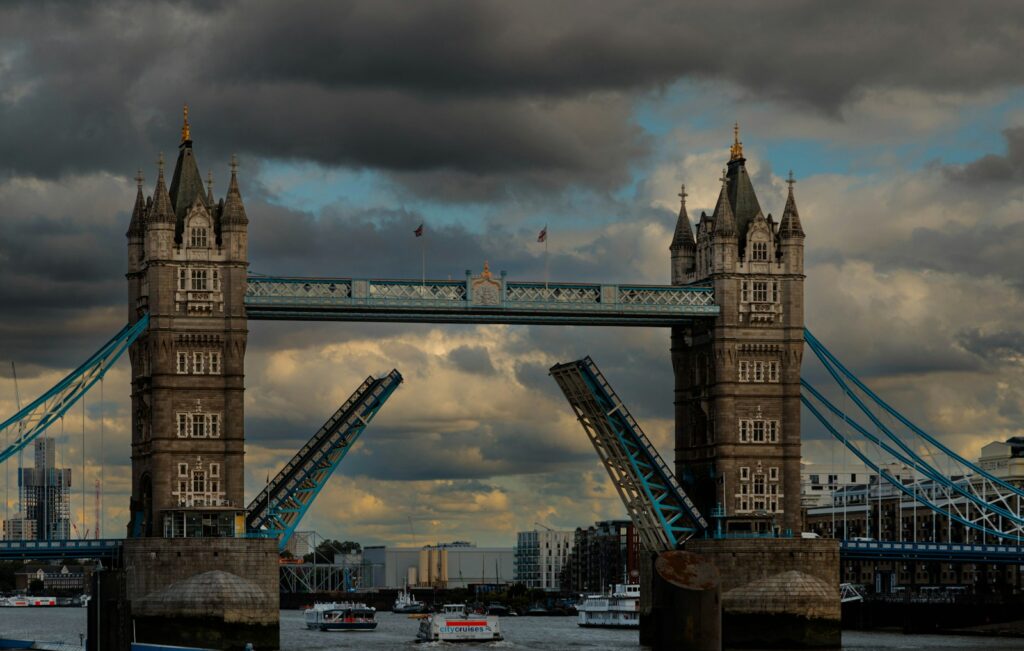 a view of a bridge with a cloudy sky in the background