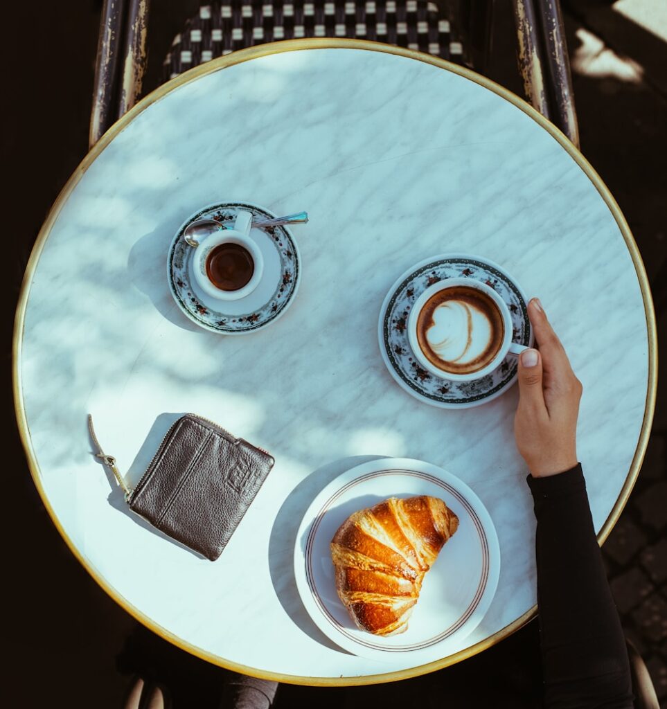 a person holding a plate with food on it
